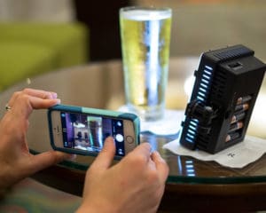 A staffer stages a promotional photo for our client, the Renaissance Nashville Hotel, using an iPhone and some simple lighting.